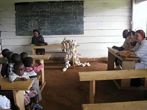 Kids with teacher and sponsors in classroom.jpg